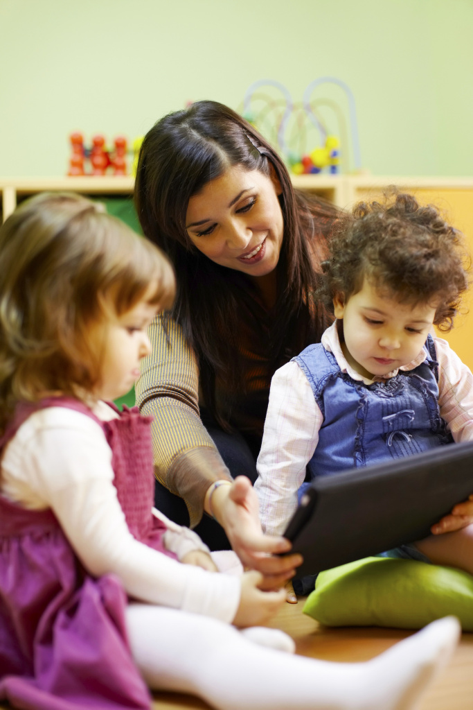 Preschool children sitting on the mat 