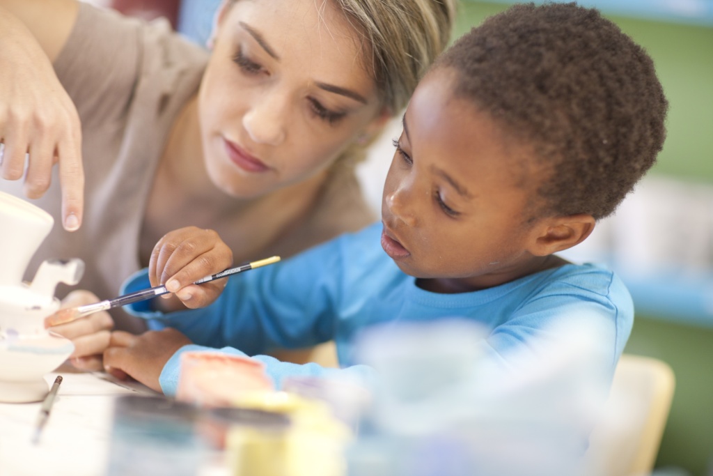 Young boy working with the teacher