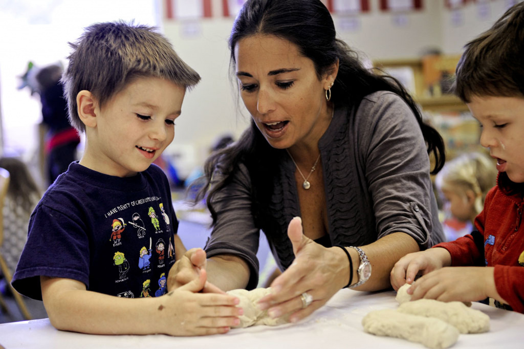 Teacher helping young student