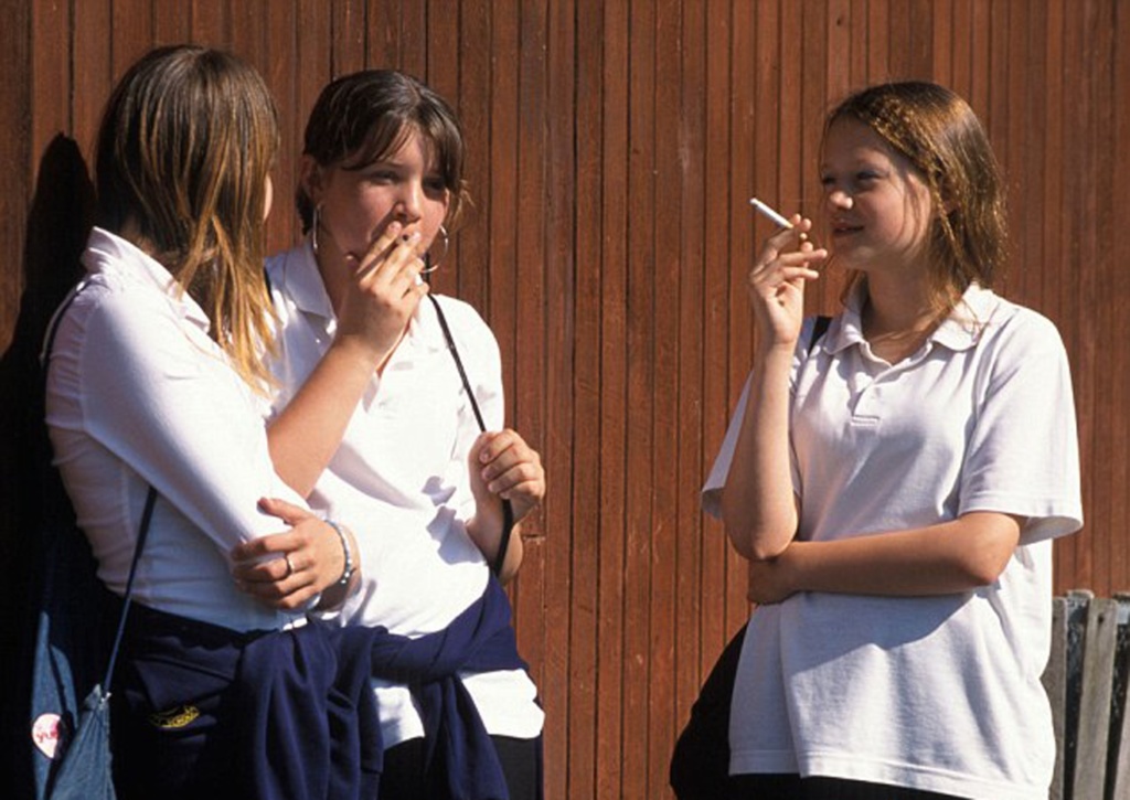 Teenage girls smoking