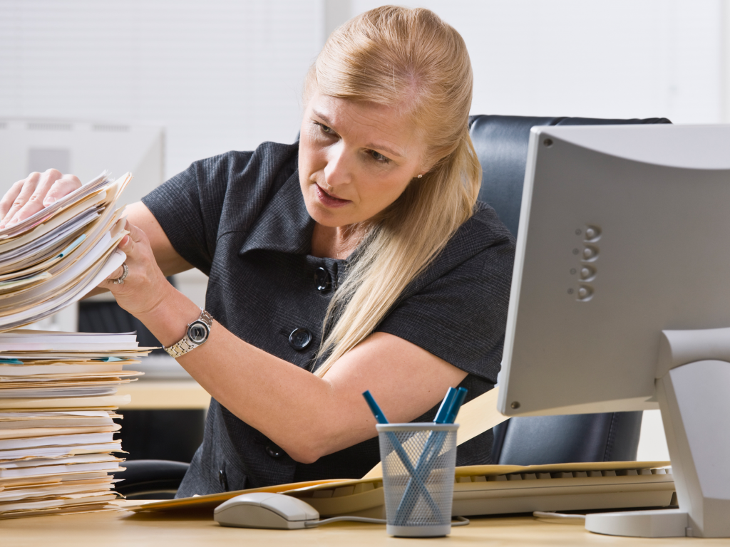 Woman looking through paper work