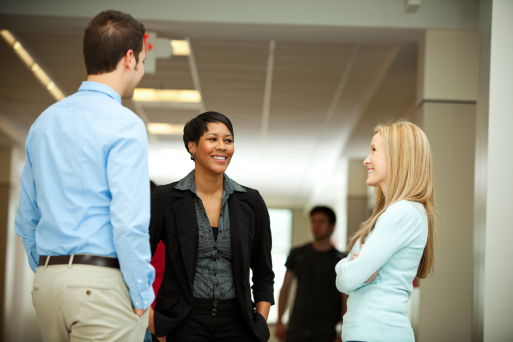 Colleagues talking to boss