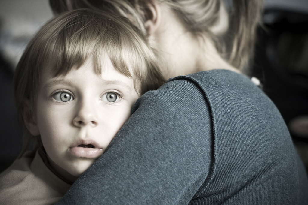 Scared child with mother