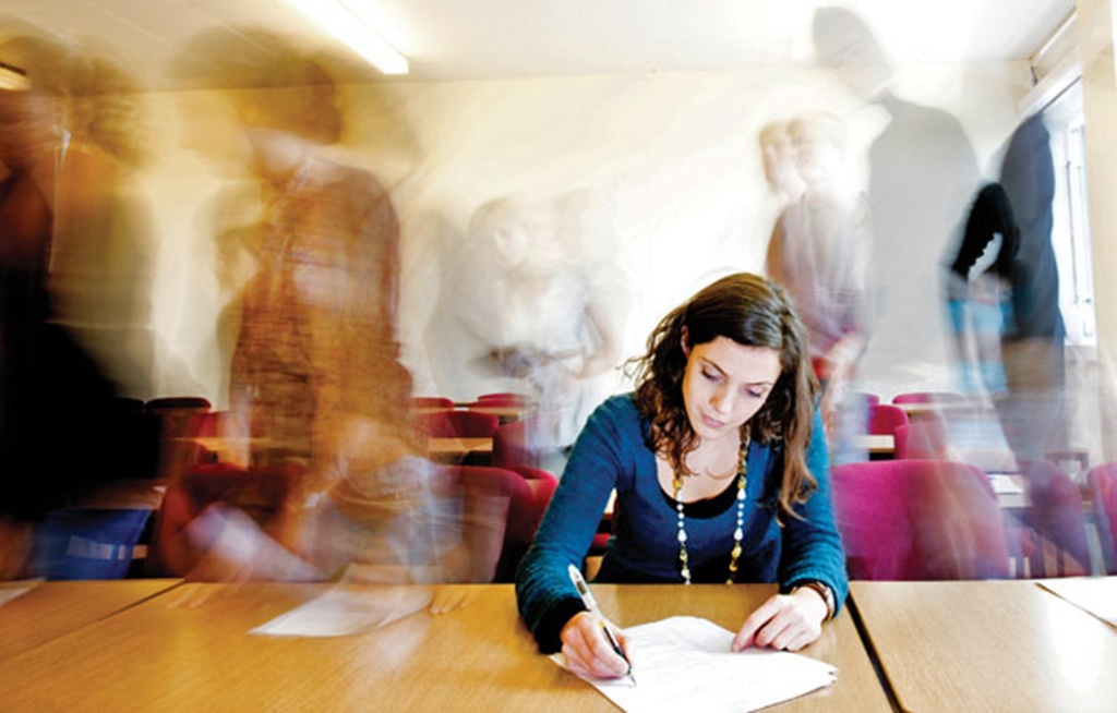 stressed female teacher at desk