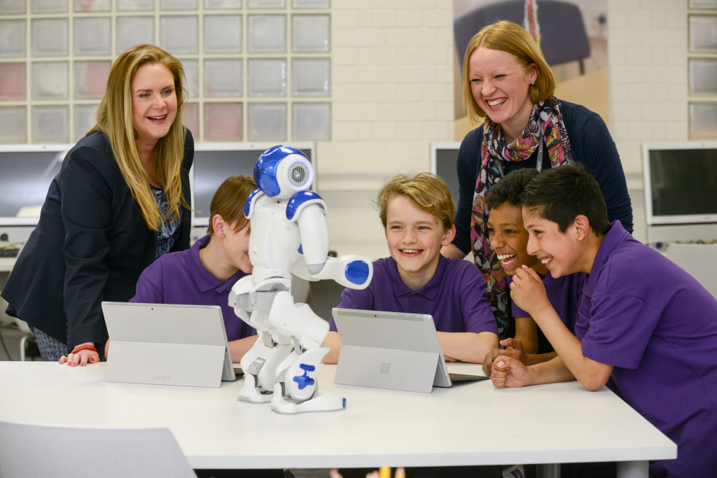 Pupils and teacher with robot