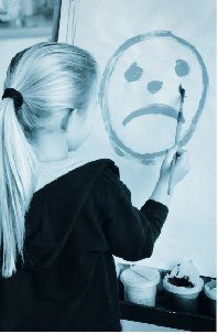 young girl painting sad face