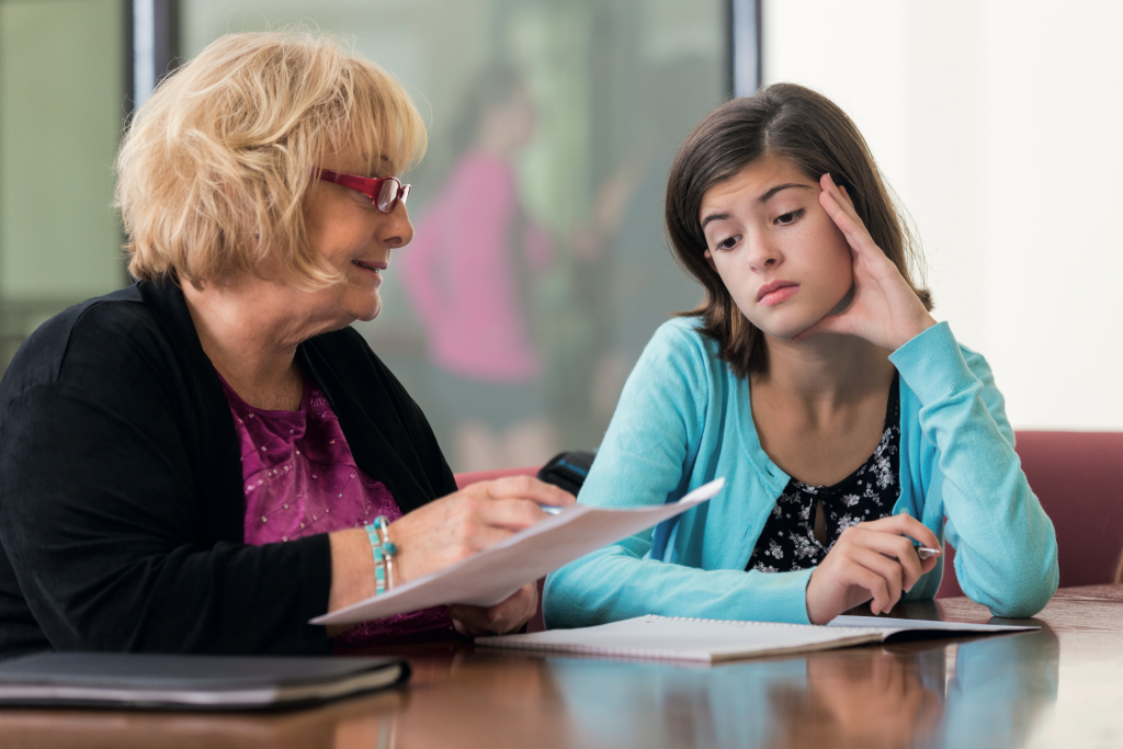 Teacher talking to student