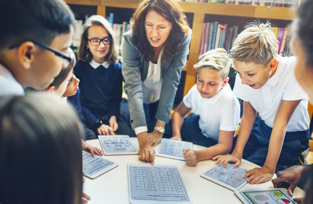 Teacher working with students