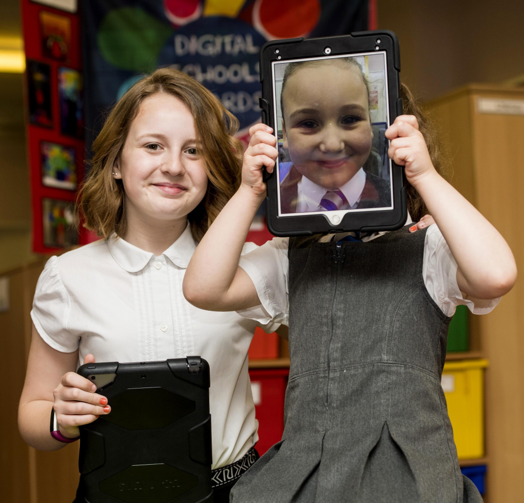 Young pupils with tablets