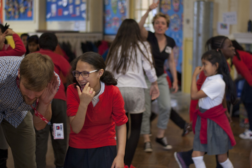 Pupils having fun with teachers at New City Primary