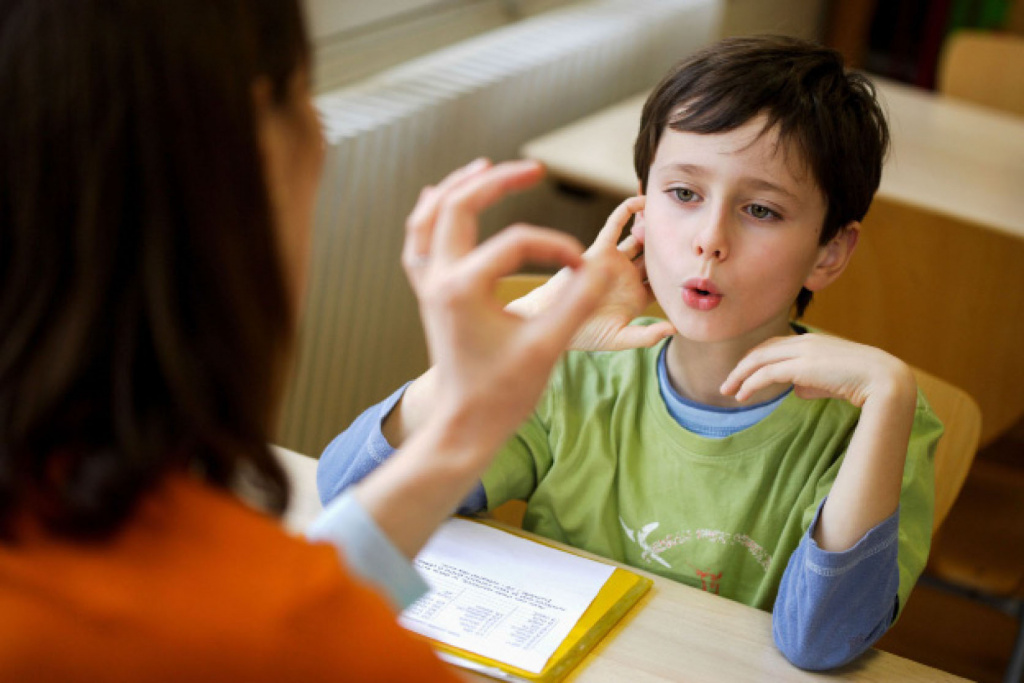 Young boy in speech lesson