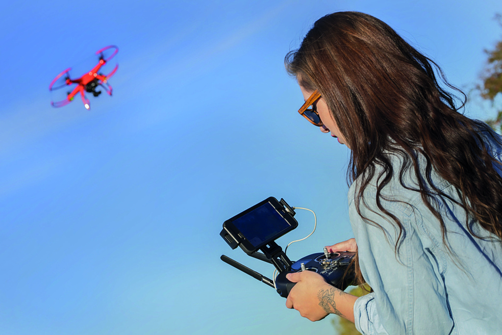Girl flying drone