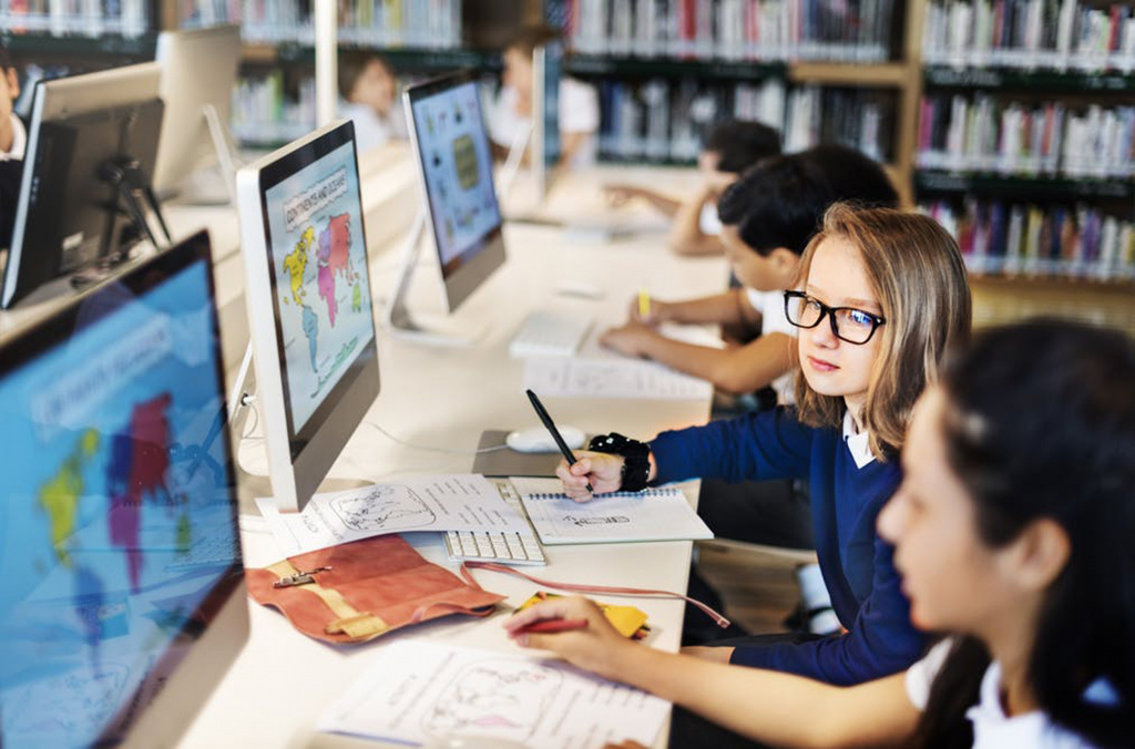 Primary school pupils using computers
