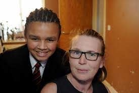 boys with corn rows with his mother