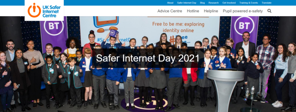 Children and adults from many nations with a baner saying Internet Safety Day 2021