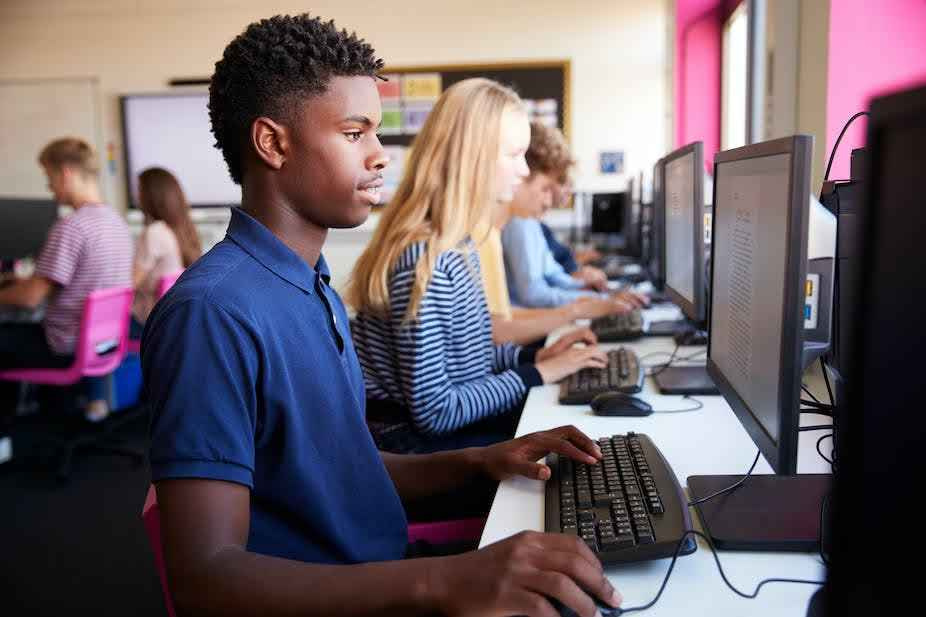 American high school students using computers.