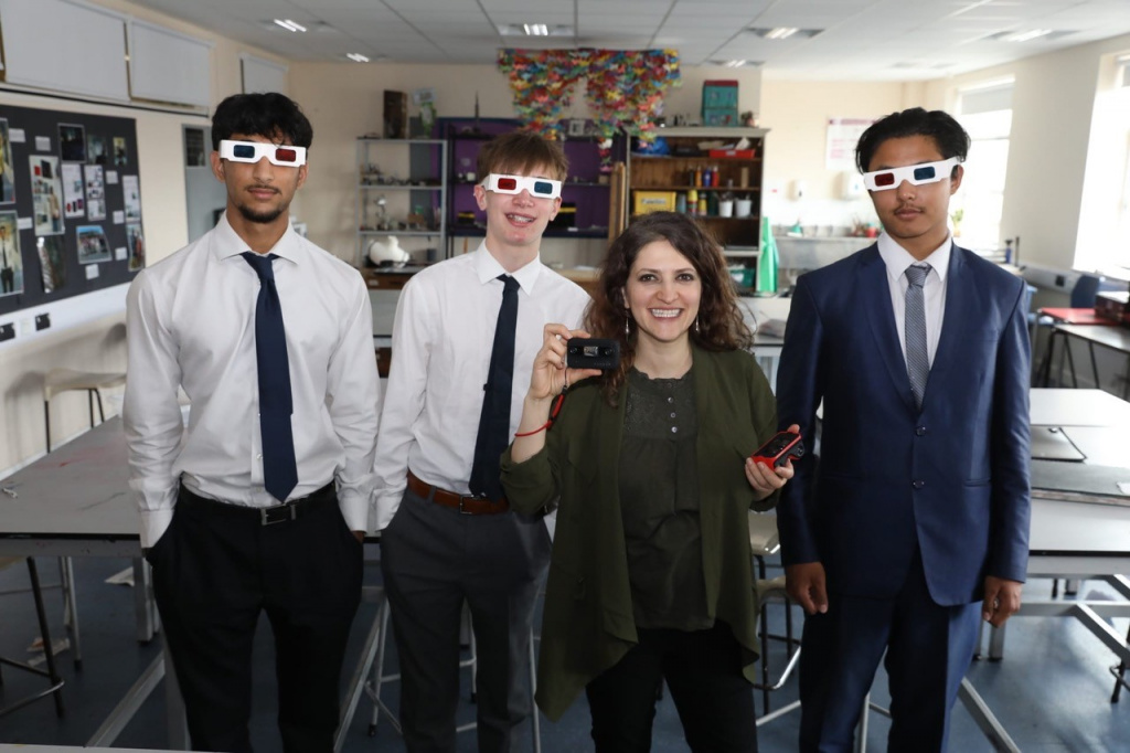 Secondary school students wearing 3D glasses